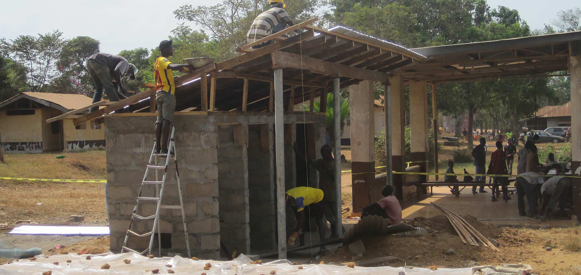 The new restrooms for the admissions building take shape. A cesspit to serve this facility was also built to our plan.